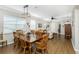 Charming dining room with hardwood floors, wooden table, and six chairs at 24490 Wallaby Ln, Punta Gorda, FL 33955