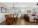 Bright dining area with hardwood floors and a wooden dining set at 24490 Wallaby Ln, Punta Gorda, FL 33955