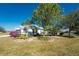Single story home showcasing a well-maintained exterior and landscaping at 24490 Wallaby Ln, Punta Gorda, FL 33955