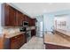 Modern kitchen with granite countertops and stainless steel appliances at 24490 Wallaby Ln, Punta Gorda, FL 33955