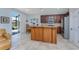 Kitchen with island, stainless steel appliances, and granite countertops at 24490 Wallaby Ln, Punta Gorda, FL 33955