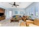 Relaxing living room with leather furniture and ceiling fan at 24490 Wallaby Ln, Punta Gorda, FL 33955