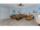 Spacious living area with leather furniture and large windows at 24490 Wallaby Ln, Punta Gorda, FL 33955