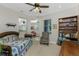 Home office with daybed, built-in shelving, and comfy chair at 24490 Wallaby Ln, Punta Gorda, FL 33955