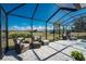 Relaxing screened pool area with lounge chairs and beautiful views at 24490 Wallaby Ln, Punta Gorda, FL 33955