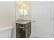 Bathroom with dark vanity and granite countertop at 2965 Vedado St, North Port, FL 34286