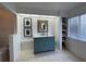 Stylish bathroom featuring vanity with granite countertop, built in shelving and shiplap walls at 3202 Meadow Run Dr, Venice, FL 34293