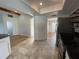 Open kitchen with tile floor, white cabinets, stainless steel appliances, and plenty of counter space at 3202 Meadow Run Dr, Venice, FL 34293