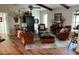 Cozy living room featuring hardwood floors, natural light and a comfortable seating area at 3202 Meadow Run Dr, Venice, FL 34293