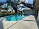 Relaxing pool featuring a screened enclosure and a spacious deck for outdoor entertaining at 3202 Meadow Run Dr, Venice, FL 34293
