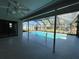 Screened-in pool with a spacious deck and a tranquil view, perfect for leisure and entertainment at 3202 Meadow Run Dr, Venice, FL 34293