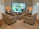 Comfortable sitting area featuring four armchairs and view of the pool area at 3202 Meadow Run Dr, Venice, FL 34293