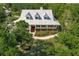 Bird's eye view of a white farmhouse on a large lot with lush trees at 3800 Acline Rd, Punta Gorda, FL 33950