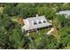 Elevated view of a charming house nestled amongst the trees at 3800 Acline Rd, Punta Gorda, FL 33950