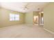 Spacious bedroom with ceiling fan and large window at 3800 Acline Rd, Punta Gorda, FL 33950
