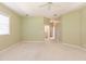 Bright bedroom featuring a ceiling fan and en-suite bathroom at 3800 Acline Rd, Punta Gorda, FL 33950