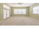 Large bedroom with neutral walls, carpet and French doors at 3800 Acline Rd, Punta Gorda, FL 33950