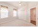 Bedroom with two windows, ceiling fan and closet at 3800 Acline Rd, Punta Gorda, FL 33950