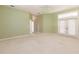 Large bedroom with double doors leading to outside at 3800 Acline Rd, Punta Gorda, FL 33950