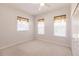 Well-lit bedroom with double closets and ceiling fan at 3800 Acline Rd, Punta Gorda, FL 33950