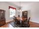 Formal dining room featuring hardwood floors and large windows at 3800 Acline Rd, Punta Gorda, FL 33950