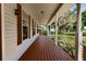 Relaxing front porch with a view of the backyard at 3800 Acline Rd, Punta Gorda, FL 33950
