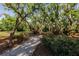 White gravel path through a shady garden area at 3800 Acline Rd, Punta Gorda, FL 33950