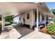 Ranch-style home with carport, covered porch, and mature landscaping at 3800 Acline Rd, Punta Gorda, FL 33950