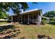 Ranch-style home with large screened porch and landscaped yard at 3800 Acline Rd, Punta Gorda, FL 33950