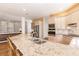 Island kitchen with granite countertops and double sink at 3800 Acline Rd, Punta Gorda, FL 33950