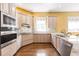 Spacious kitchen with granite counters, ample cabinets, and hardwood floors at 3800 Acline Rd, Punta Gorda, FL 33950