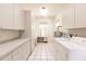 Laundry room with built-in cabinets and a washer and dryer at 3800 Acline Rd, Punta Gorda, FL 33950