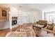 Bright living room featuring hardwood floors and a cozy fireplace at 3800 Acline Rd, Punta Gorda, FL 33950