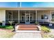 Enclosed porch with double doors and wooden steps at 3800 Acline Rd, Punta Gorda, FL 33950