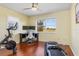 Bright bedroom with hardwoord floors, large window, and plenty of space for exercise equipment at 3818 Bordeaux Dr, Punta Gorda, FL 33950