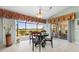 Cozy breakfast nook with views of the screened lanai and the golf course at 3818 Bordeaux Dr, Punta Gorda, FL 33950