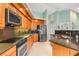 Modern kitchen featuring granite countertops, stainless steel appliances, and ample cabinet space at 3818 Bordeaux Dr, Punta Gorda, FL 33950