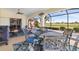 Covered lanai perfect for outdoor dining and relaxation with views of the golf course at 3818 Bordeaux Dr, Punta Gorda, FL 33950