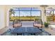 Screened lanai with comfortable seating and serene views of the surrounding landscape at 3818 Bordeaux Dr, Punta Gorda, FL 33950