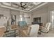 Living room with coffered ceiling, comfortable seating and a large TV at 3990 La Costa Island Ct, Punta Gorda, FL 33950