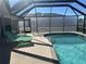 Spacious pool with covered lanai and comfortable lounge chairs at 4218 Yucatan Cir, Port Charlotte, FL 33948