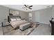 Bedroom with ceiling fan, ensuite bathroom and a modern rug at 5587 E Price Blvd, North Port, FL 34288