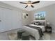 Bedroom with a ceiling fan, closet, and modern decor at 5587 E Price Blvd, North Port, FL 34288