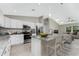 Spacious kitchen with granite island, stainless appliances, and open to living area at 5587 E Price Blvd, North Port, FL 34288
