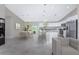 Open concept living space with kitchen, dining, and living room, plus outdoor access at 5587 E Price Blvd, North Port, FL 34288
