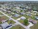 Aerial view of a residential neighborhood with various homes and streets at 817 E 6Th St, Englewood, FL 34223