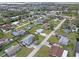 Aerial view of residential neighborhood showcasing various house styles and landscaping at 817 E 6Th St, Englewood, FL 34223