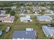 Aerial view of a single-Gathering home with backyard and boat at 817 E 6Th St, Englewood, FL 34223