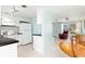 Clean, white kitchen with black countertops and modern appliances at 817 E 6Th St, Englewood, FL 34223
