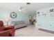 Open living area with a sofa, recliner, and access to dining area at 817 E 6Th St, Englewood, FL 34223